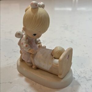 Precious moments collectible , “the hand that rocks, the future” figurine